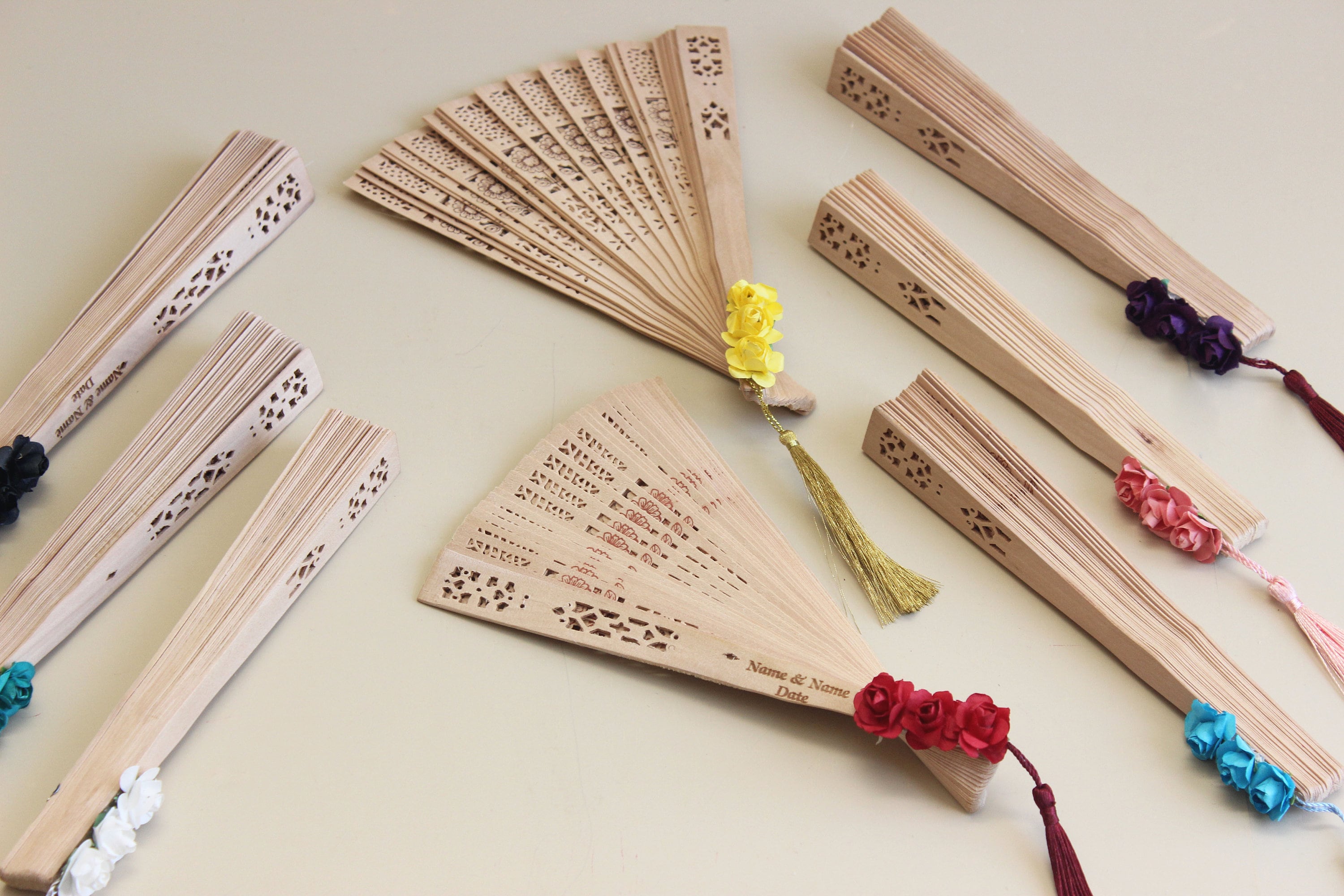 Personalized Bamboo Fan For Guest Favors With Three Paper Flower and Tassel Decorations