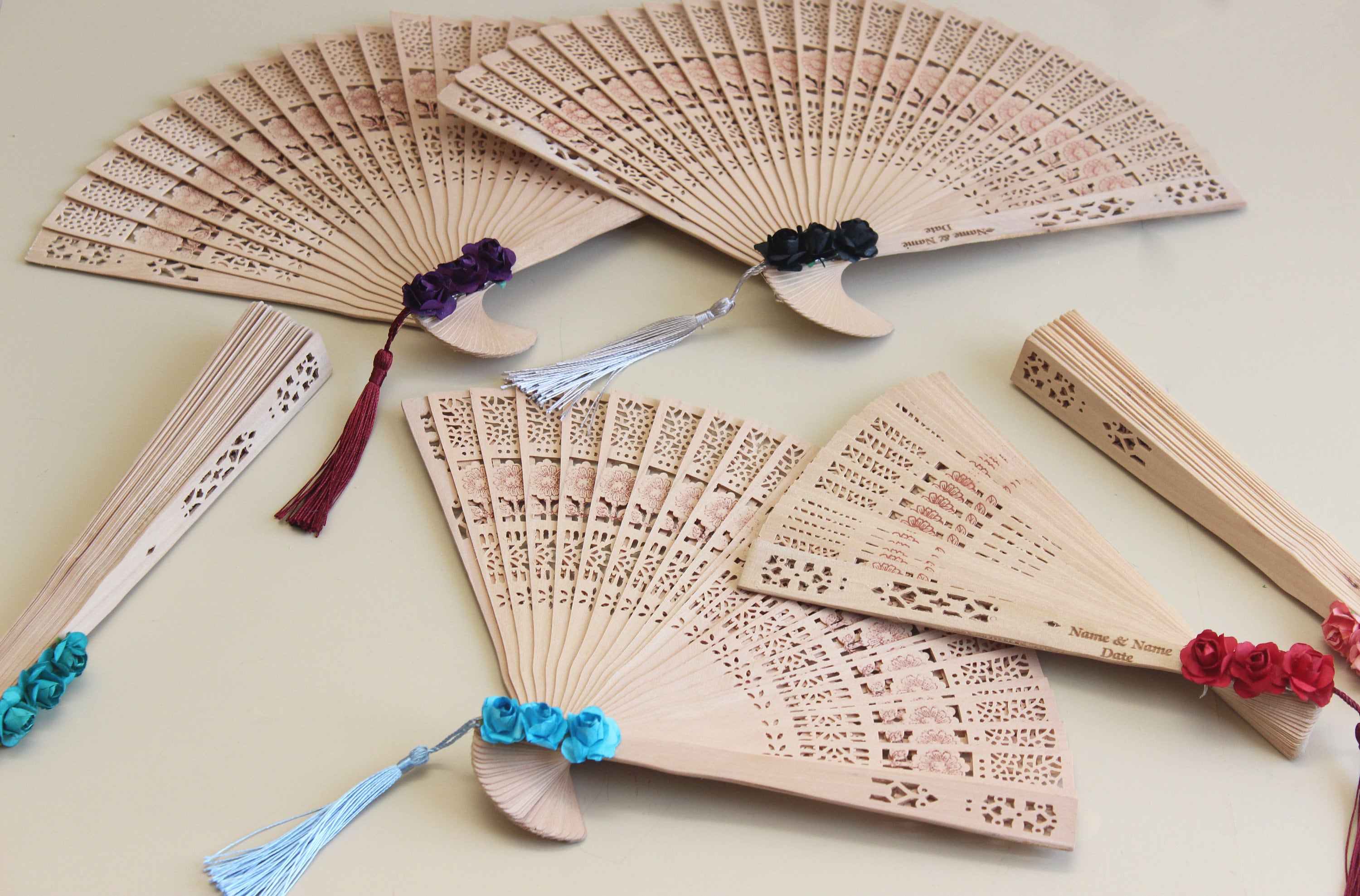 Personalized Bamboo Fan For Guest Favors With Paper Flower and Tassel Decorations